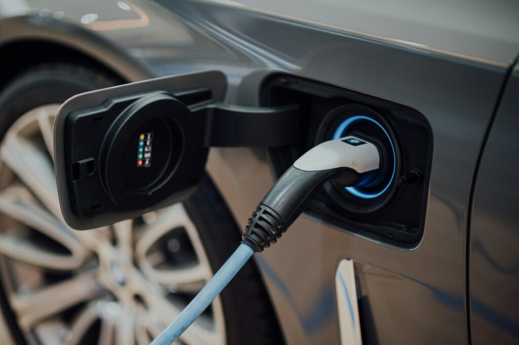 A close-up of a EV car charging.