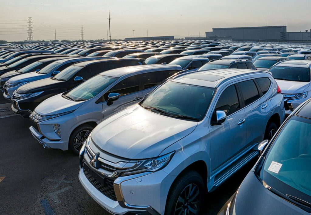 A large parking lot filled with lots of cars