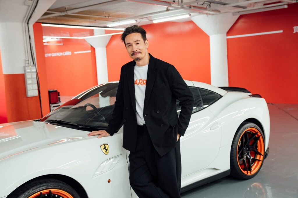 Moses Chan with one of the used Ferrari cars at Carro Hong Kong flagship showroom.