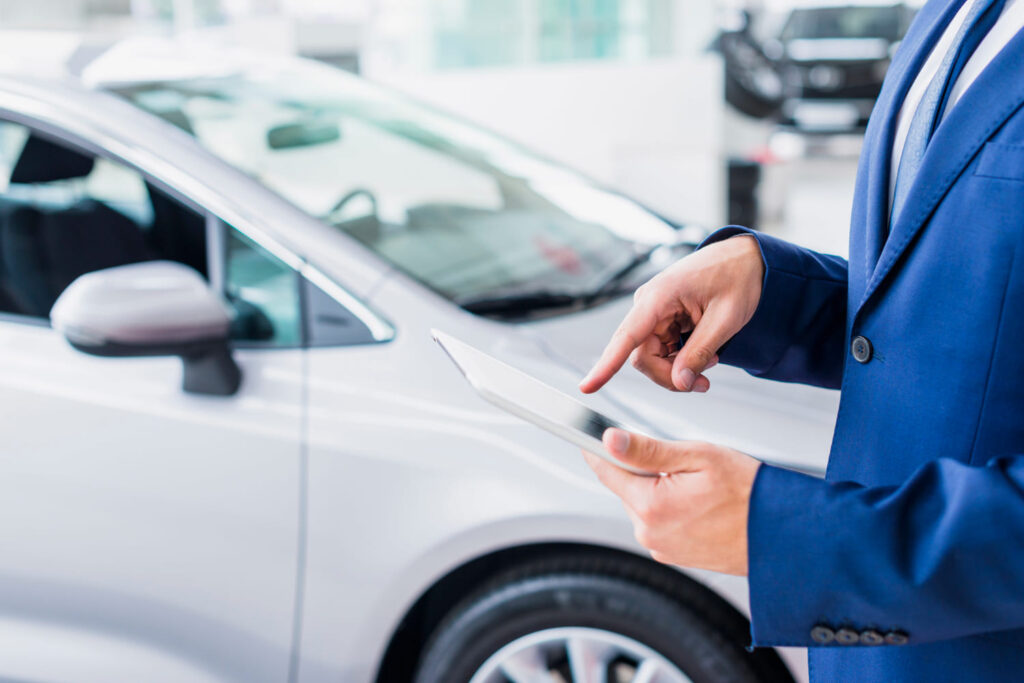 A potential car buyer is checking the car information.