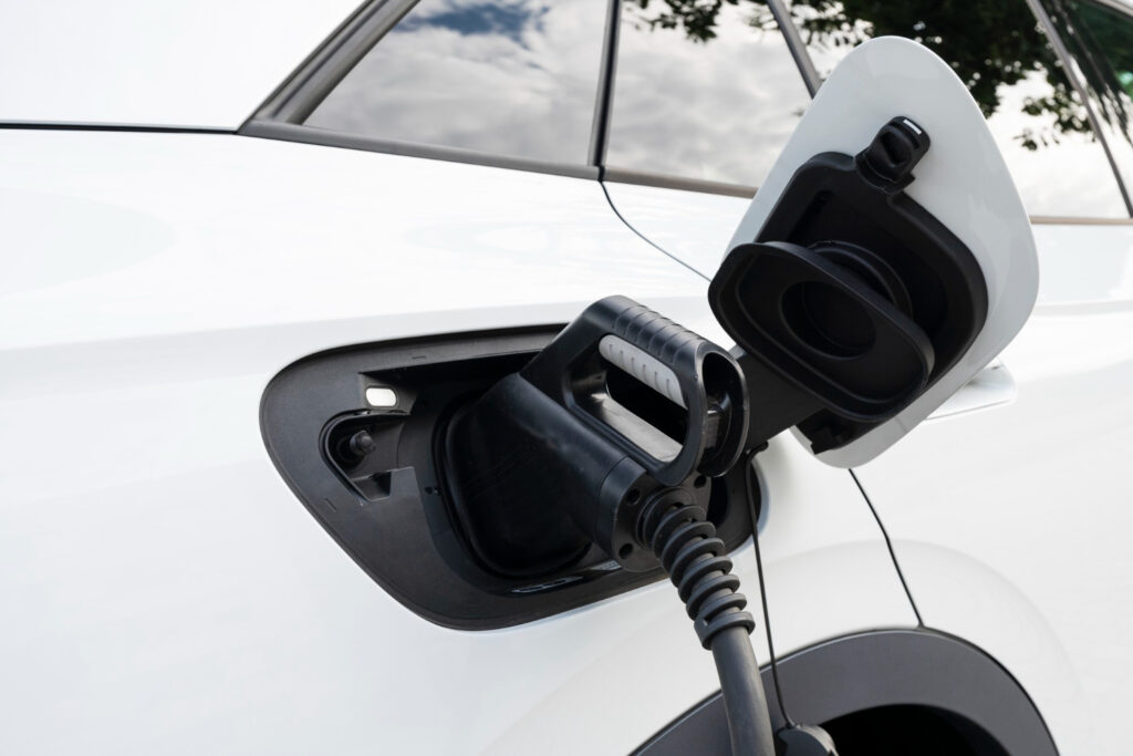 A white ev car charging.
