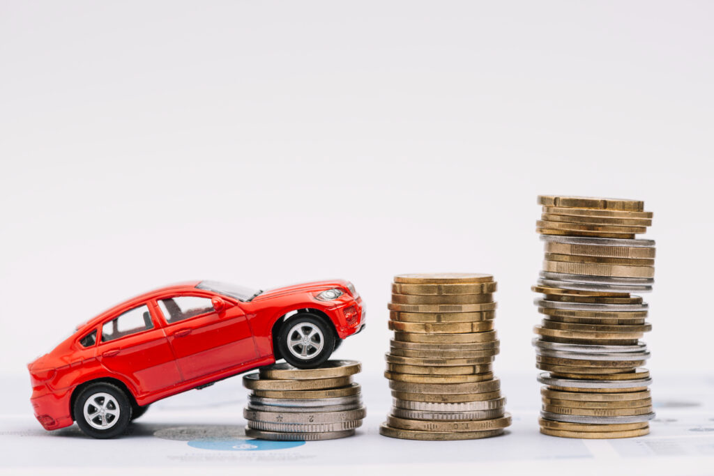 Toy car with stacking coins indicating car value.