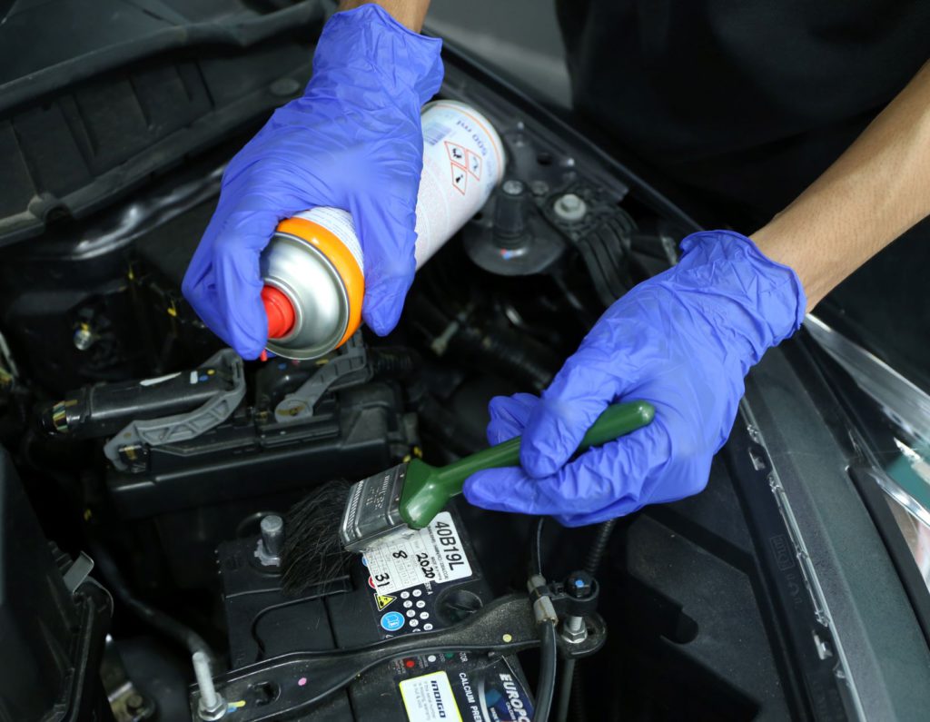 Removing rust from battery terminals