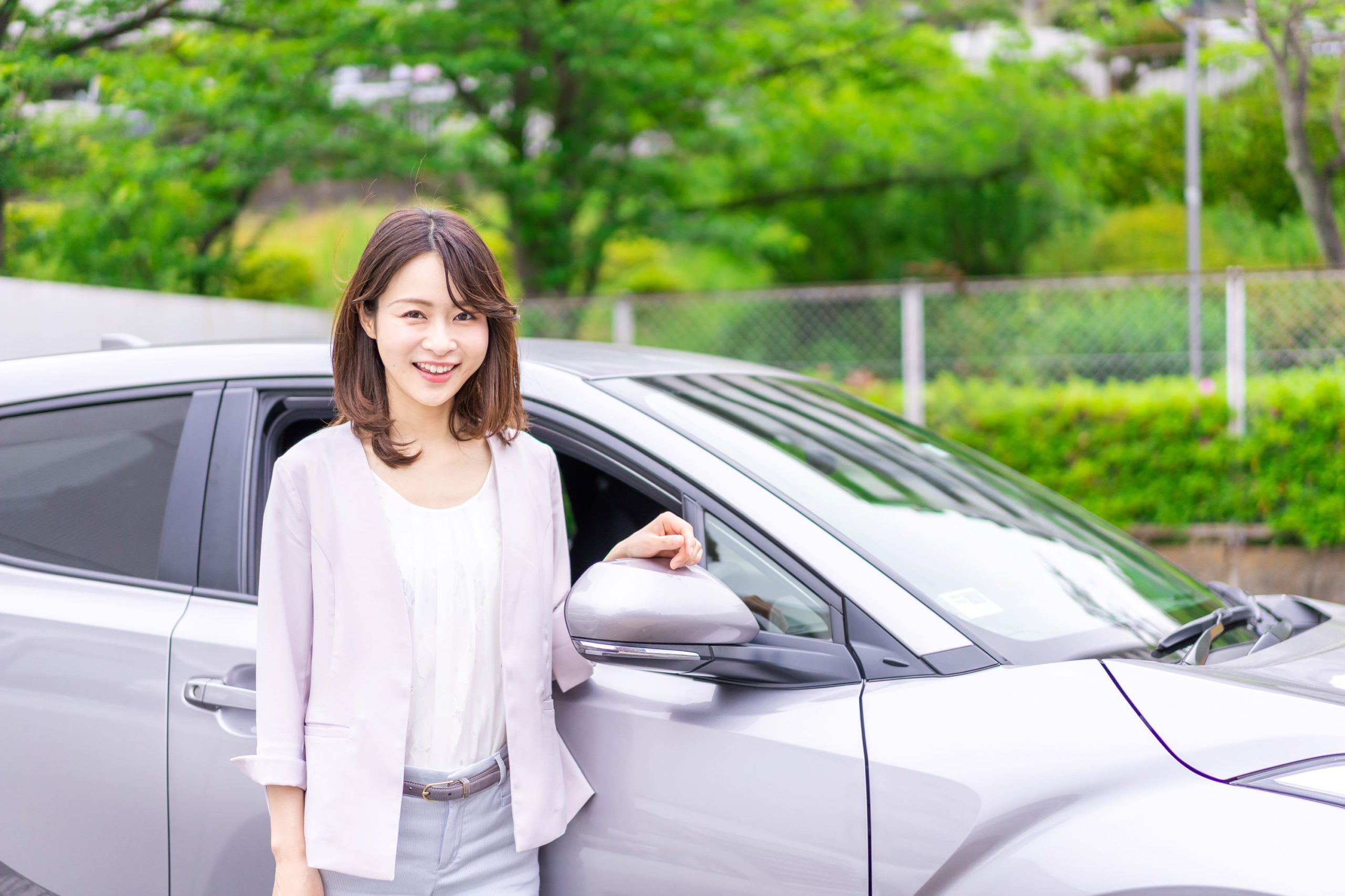 Woman next to car