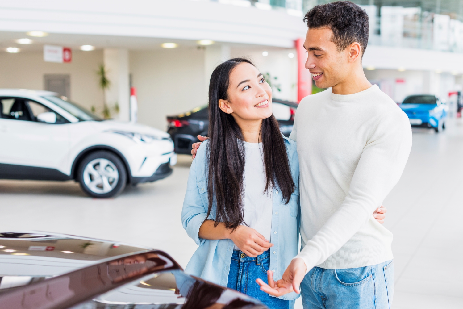 car dealership, asian couple