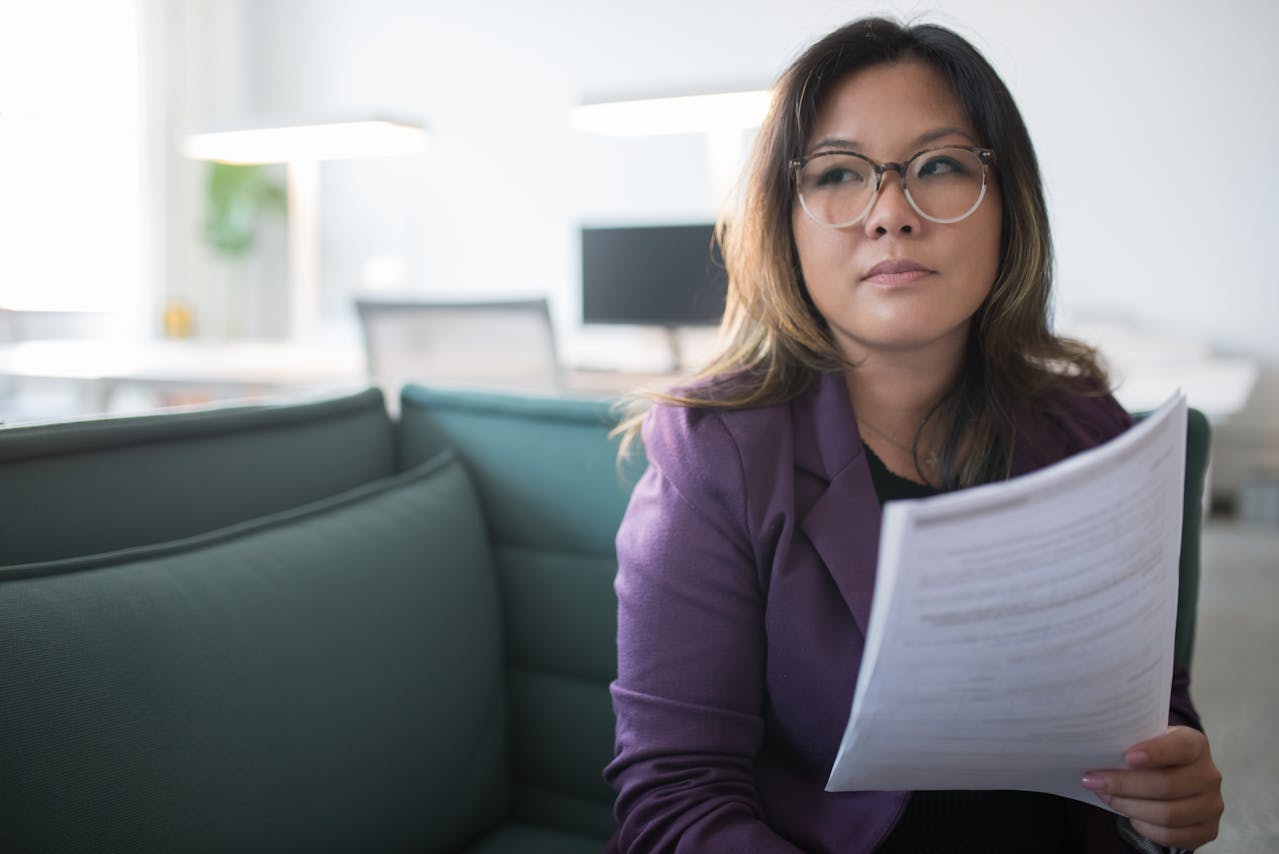 Woman, side eye, document